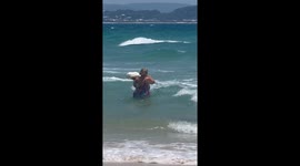 Lady takes pet duck for swim in Gold Coast surf