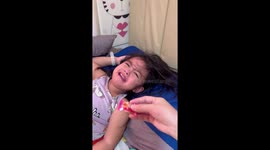 Toddler stops crying only when she receives bank note