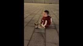 Child pretends to be hit by toy vehicle in Hebei, China
