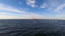Sunken fishing vessel retrieved from seabed off coast of New Jersey