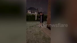 VIDEO - Dad tries to hit kid with snowball but topples over and lands on back
