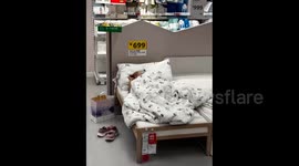 China: A Man Sleeping on IKEA’s Bed for Display