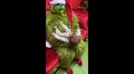Exclusive- Baby meets Grinch, giggles ensue