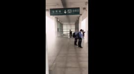 Torrential rain and gale force winds sweep through train station in China