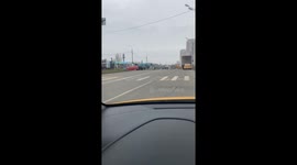Person in Batman costume crosses road in Leninsky Urban District, Moscow Region