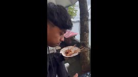 Monkey steals food at Sarangan Lake in Indonesia