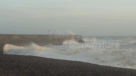 Storm Bert waves crash over Newhaven lighthouse, Sussex, UK