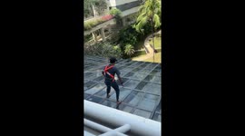 Brave hotel porter walks across glass roof to retrieve dropped iPhone