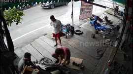 Motorbike bursts into flames while being repaired