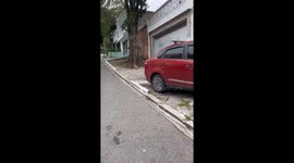 Person falls after riding toy car down slope in São Paulo
