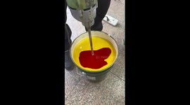 Factory worker demonstrates mesmerising paint mixing
