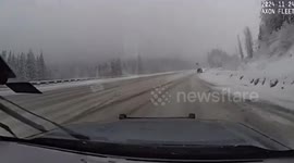 Pickup truck spins out on icy road in Washington