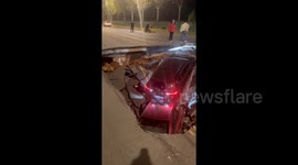 Vehicles and motorists dragged into sinkhole after road collapses in China