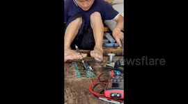 Disabled man in China repairs home appliances using his FEET