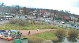 Bus smashes car and drags it for several feet after car driver tries to cut in front