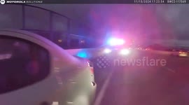 Driver rams police car door almost hitting officer inside during roadside traffic stop
