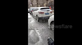 Vehicles encased in thick layer of ice as temperatures plummet in northeastern China