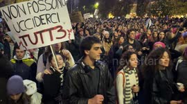Crowd of people marching during the protest against violence against women carry a sign with the slogan 'they can't kill us all' in Rome.