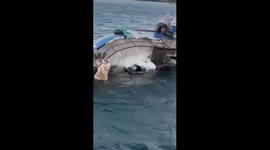 Small vessel sinks in icy Sea in Teriberka, Murmansk, Russia