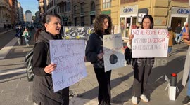 Women of Georgian origin hold signs protesting the results of the Georgian elections in an impromptu sit-in in Rome.