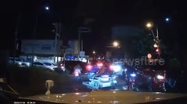 Football coach survives car being hit by oncoming train on level crossing