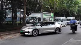 Driver uses rear wheel drive to squeeze into tiny parking space
