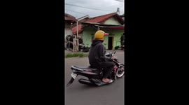 Rider skillfully rides motorcycle with only front tire in Cirebon, Indonesia