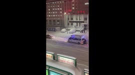 Paramedics get out carry patient when ambulance becomes stuck in snow