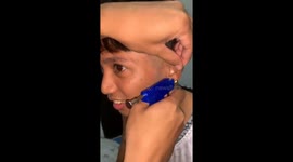 Ear piercing goes wrong when gun gets stuck in guy's lobe