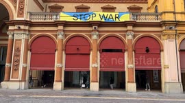 A large banner with the colors of the Ukrainian flag and the slogan ‘Stop War’ hanging next to the entrance of the Teatro Arena del Sole - Teatro Stabile of Bologna.