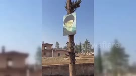 Syria: Rebels Vandalise Poster Of Iran Leader