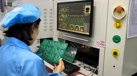 China: Employee Works on Manufacturing Industry Circuit Board