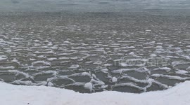 Cool pancake ice floating on the waves on Lake Superior