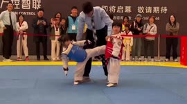 Jackie Slam! Little girl keeps falling over while trying to taekwondo kick opponent