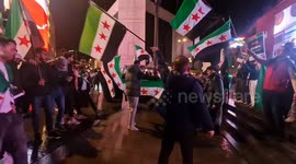 Syrian activists set off fireworks in Piccadilly Circus celebrating opposition forces taking city of Aleppo
