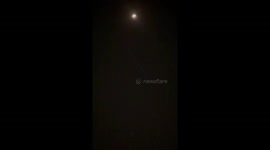 UFO flying the the stars, train like movements, flickering lights like windows went across the entire sky