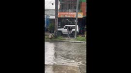Guy avoids getting wet, gets splash bombed by car in Tauramena, Colombia