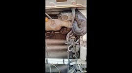 Huge python found curled up in car engine in India