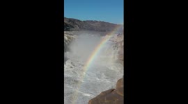 Rainbow arches over Hukou Waterfall on China's Yellow River