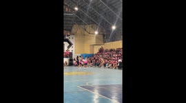 Basketball player scores with backwards volleyball shot in Carcar City, Cebu