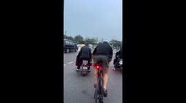 Cyclist balances effortlessly at intersection