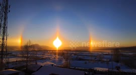 Stunning sundog phenomenon shimmers above wintery backdrop in China