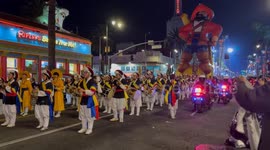 A big ballon and dances in the Hollywood Christmas parade 2024 in Los Angeles, California