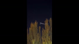 Shenzhou 18 return capsule lights up night sky in Xinjiang, China