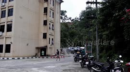 Landslide destroys car park and building in Thailand as floods kill 22