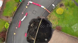 Sinkhole that appeared at the end of one of a residents driveway