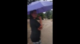 Children play in flood as storm batters the Philippines