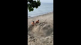 Sand artists make terrifying gargoyle face in sand