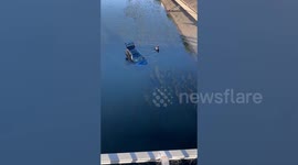 Brave passerby rescues people from partially submerged SUV in canal
