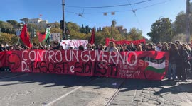 Students protest behind a banner with the slogan ‘against a government of fascists and Zionists’ during the No Meloni Day protest march in Rome.